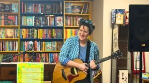 sophie coyle performing at local bookstore roe river books